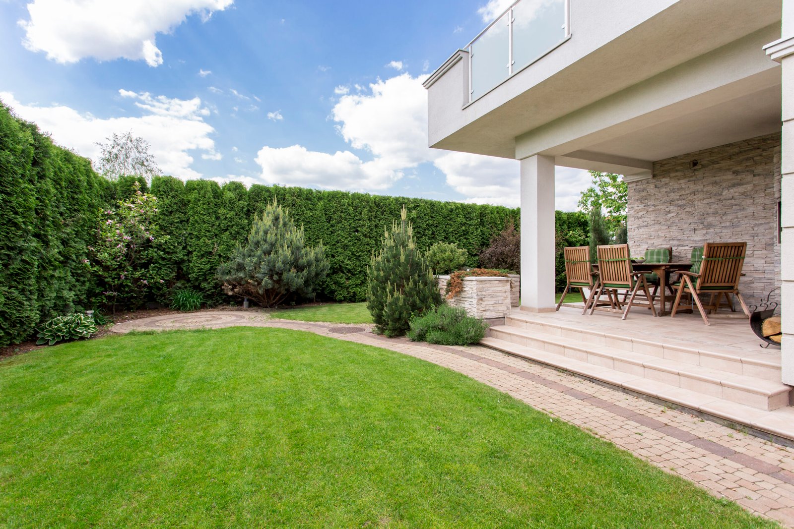 Lush backyard garden designed by landscapers in Danbury, CT